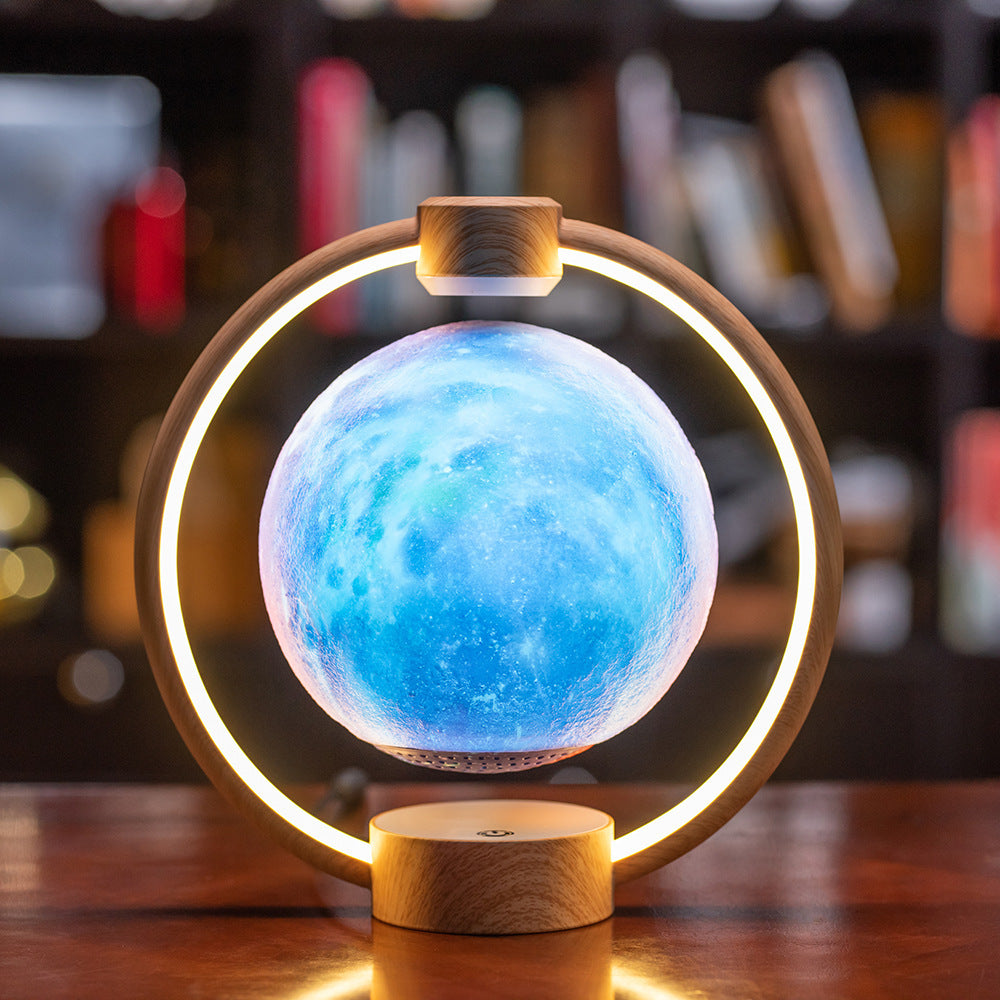Decorative lamp with a blue sphere and wooden base on a wooden surface.