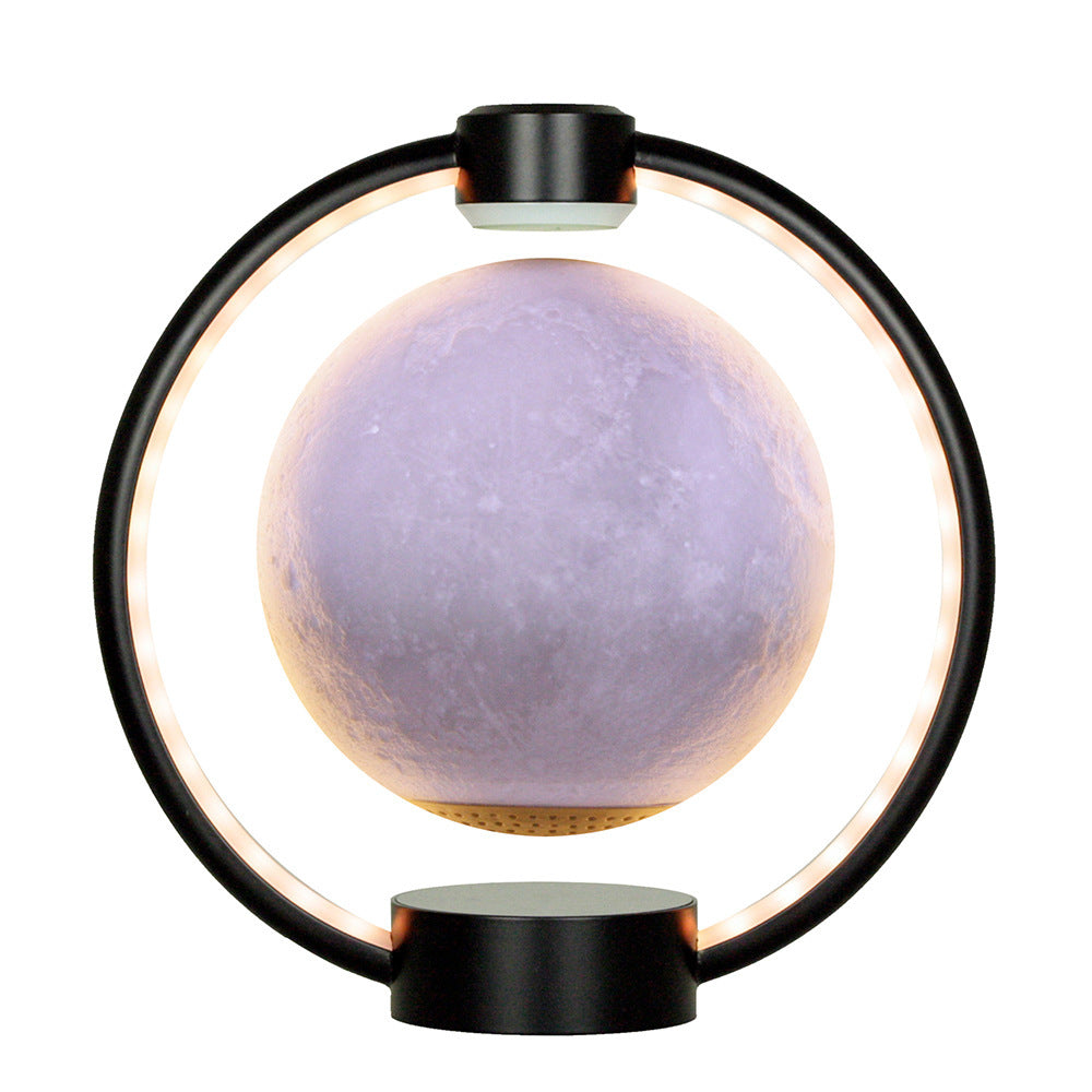Moon lamp with black circular base and light purple sphere on a white background
