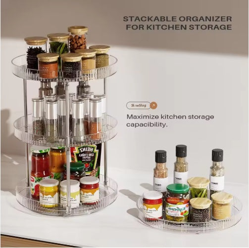 Stackable organizer for kitchen storage with various jars and bottles on a white surface.