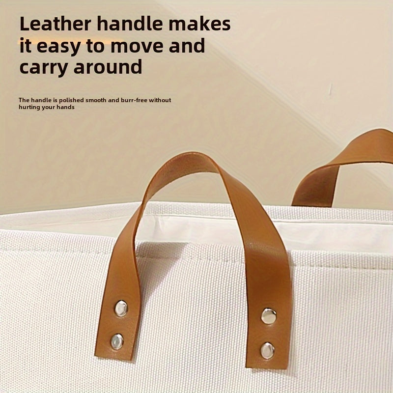 White bag with brown leather handles on a beige background