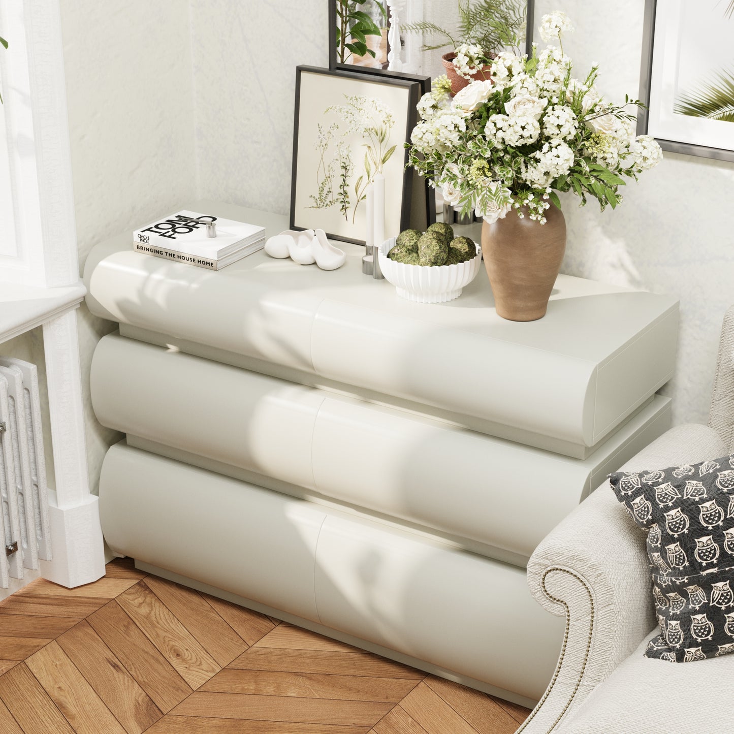White console table with decorative items in a living room setting